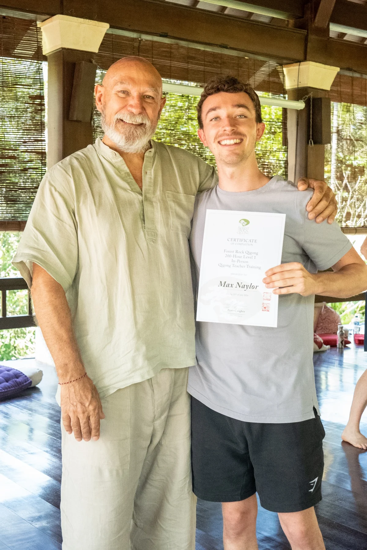 Max and his teacher together with his Qigong training certificate